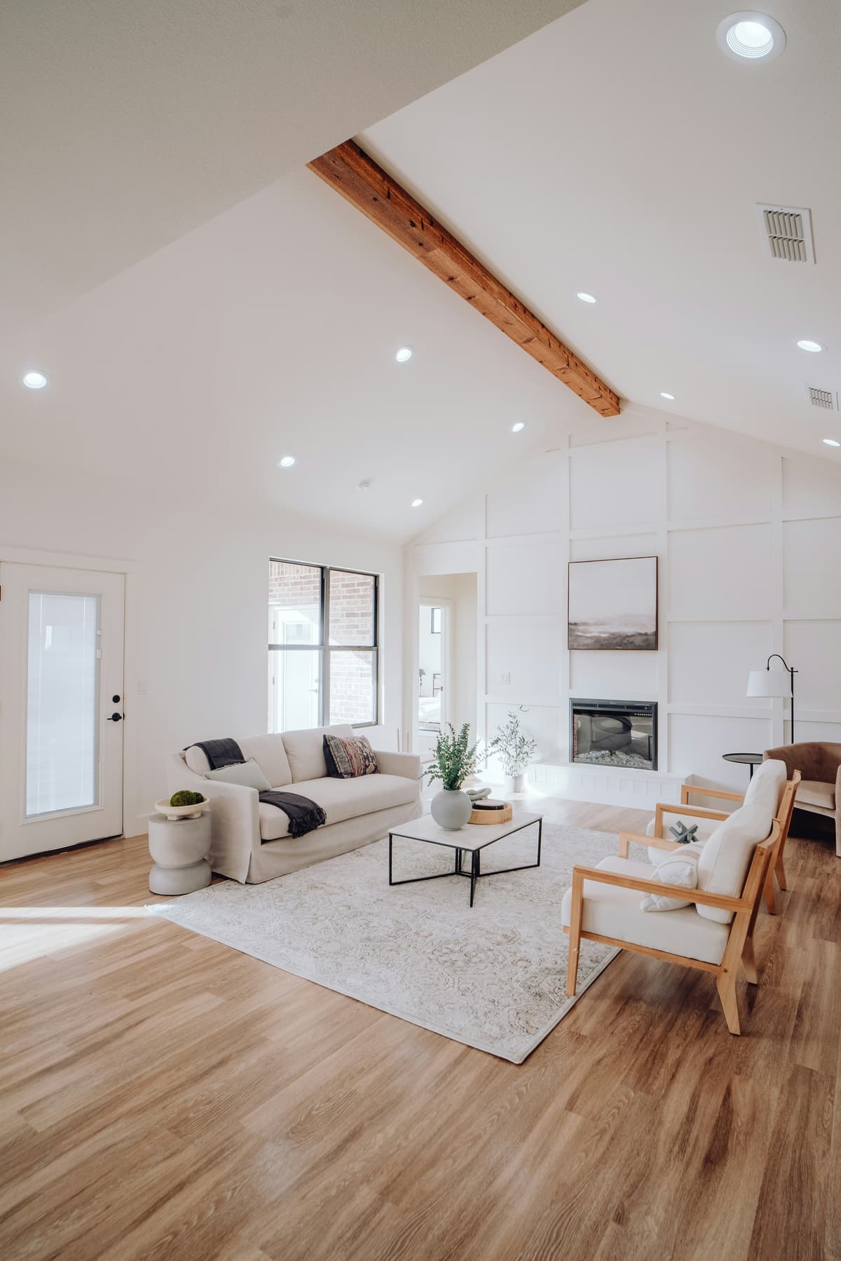 Bright vaulted living room with freshly painted white walls and ceiling in an Oakwood, Derby home